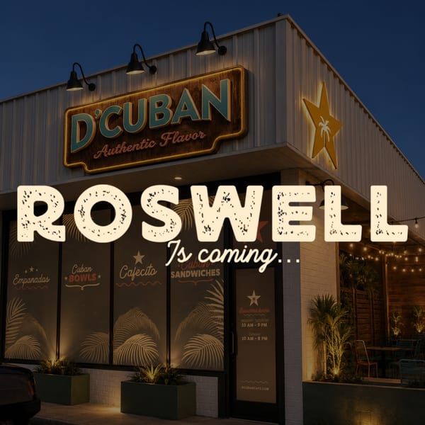 Exterior of D'Cuban restaurant at night, with "Roswell Is Coming" overlay and menu items on windows.